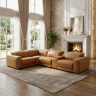 Brown leather sectional sofa in a living room with a fireplace and large windows.