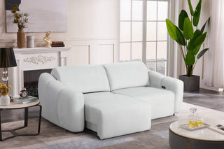 White sofa in a living room setting with decor elements.