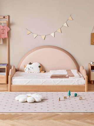 Children's bedroom with a wooden bed, toys, and decorative elements.