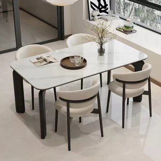 Dining table set with chairs in a modern interior setting