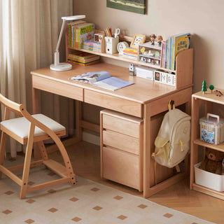 kids Wooden study desk with chair, books, and stationery in a room setting.