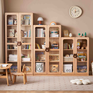 Wooden bookshelf with glass doors in a room with a clock on the wall.