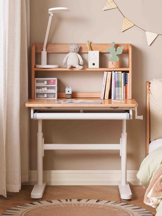 Wooden desk with shelves and books in a room setting