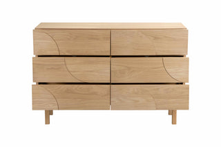 Wooden dresser with six drawers on a white background