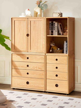 Wooden storage unit with doors and drawers in a room setting.